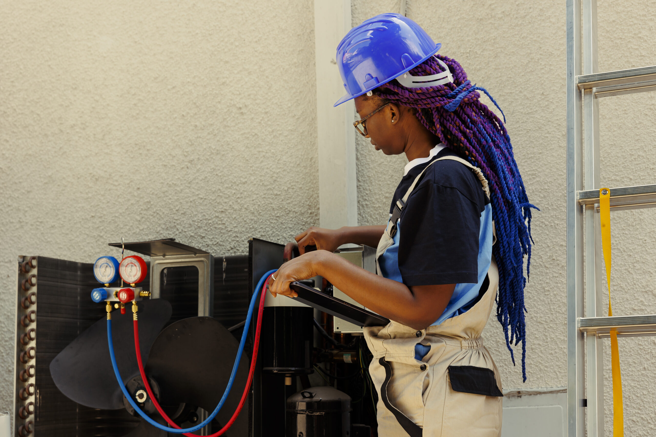 Worker finds faulty condenser component