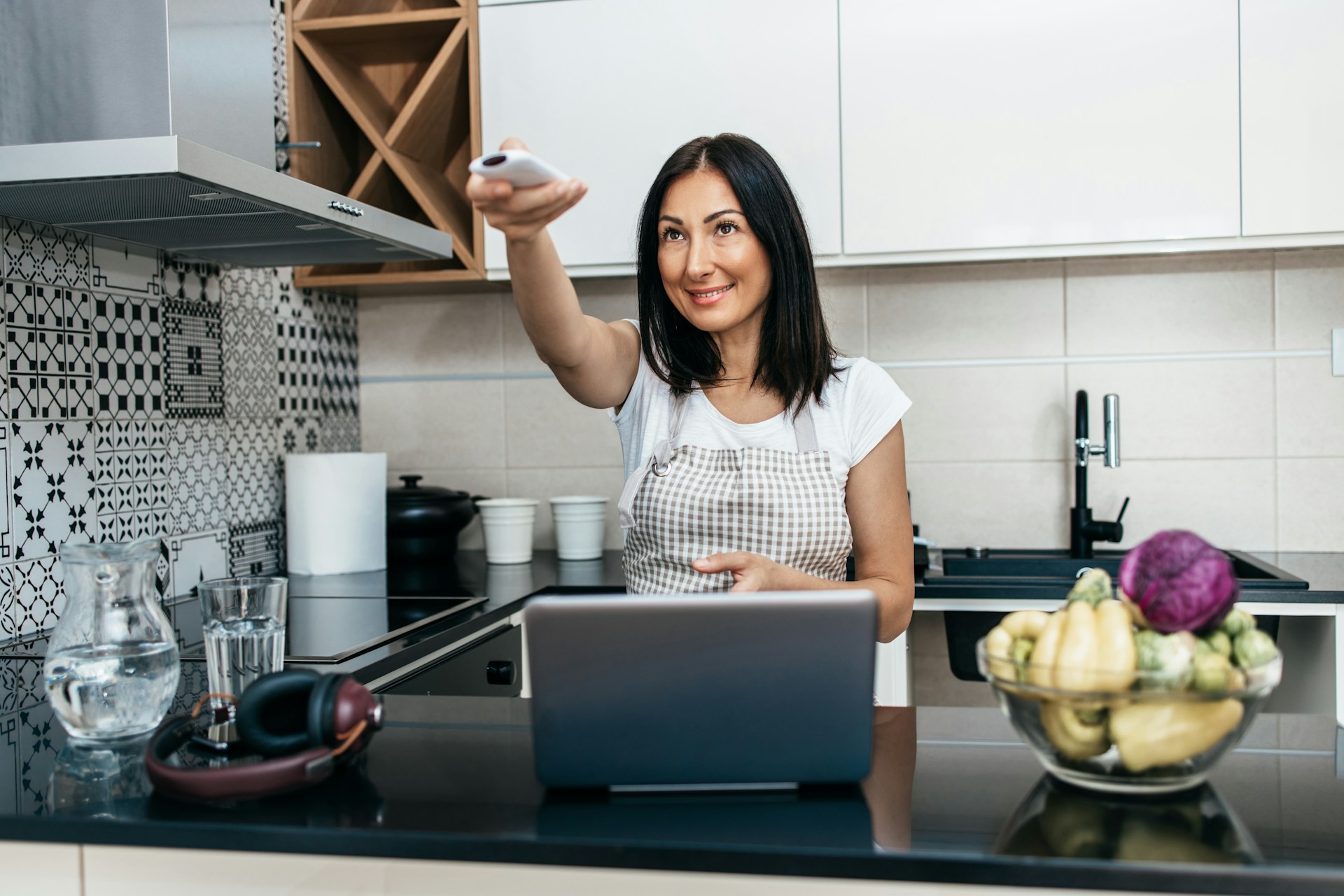 woman turning on ac